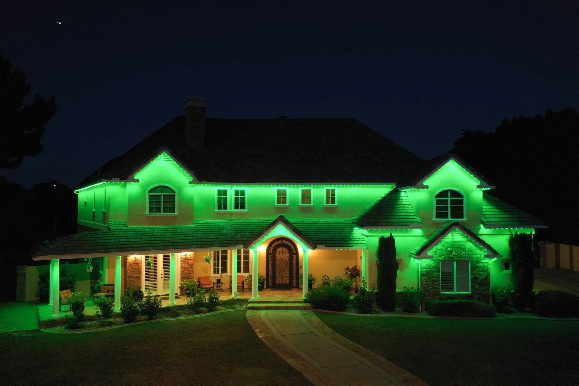Home exterior with permanent LED fixtures