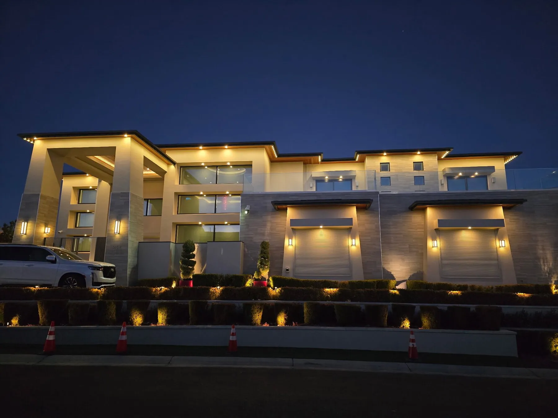Warm architectural lighting on a contemporary home at dusk