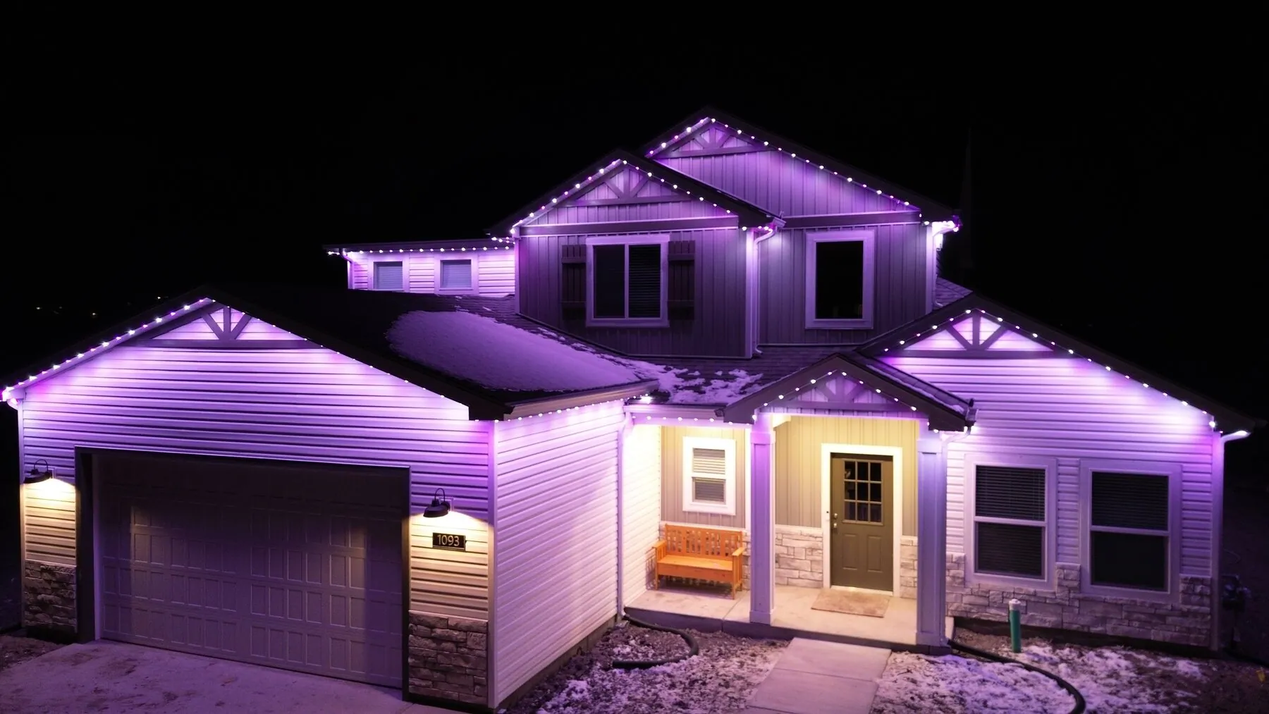 Purple permanent lighting on a home at night