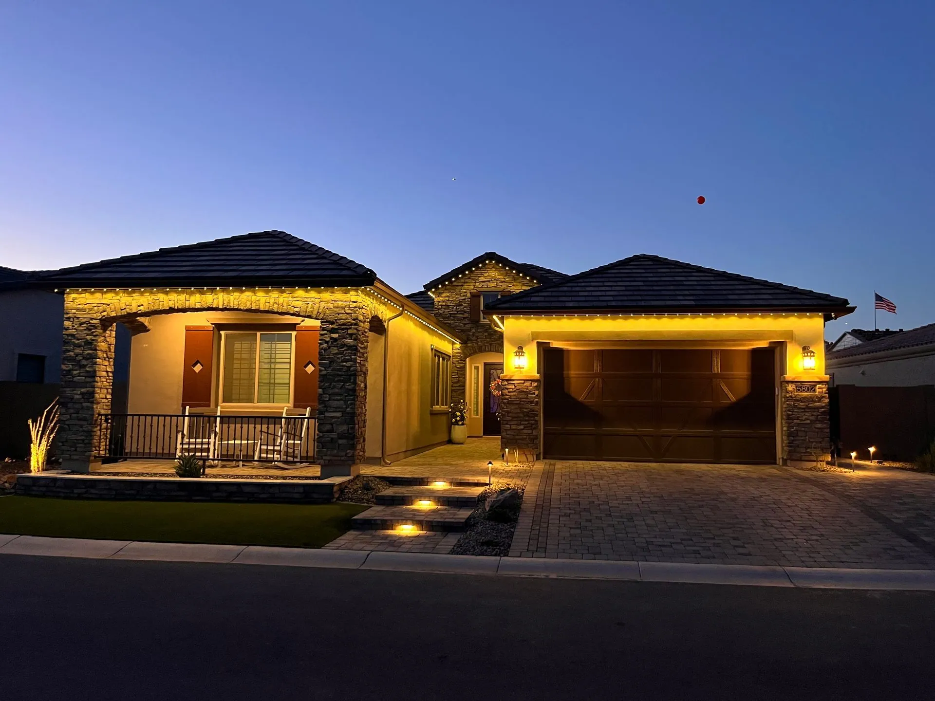 Warm white roofline lighting at dusk