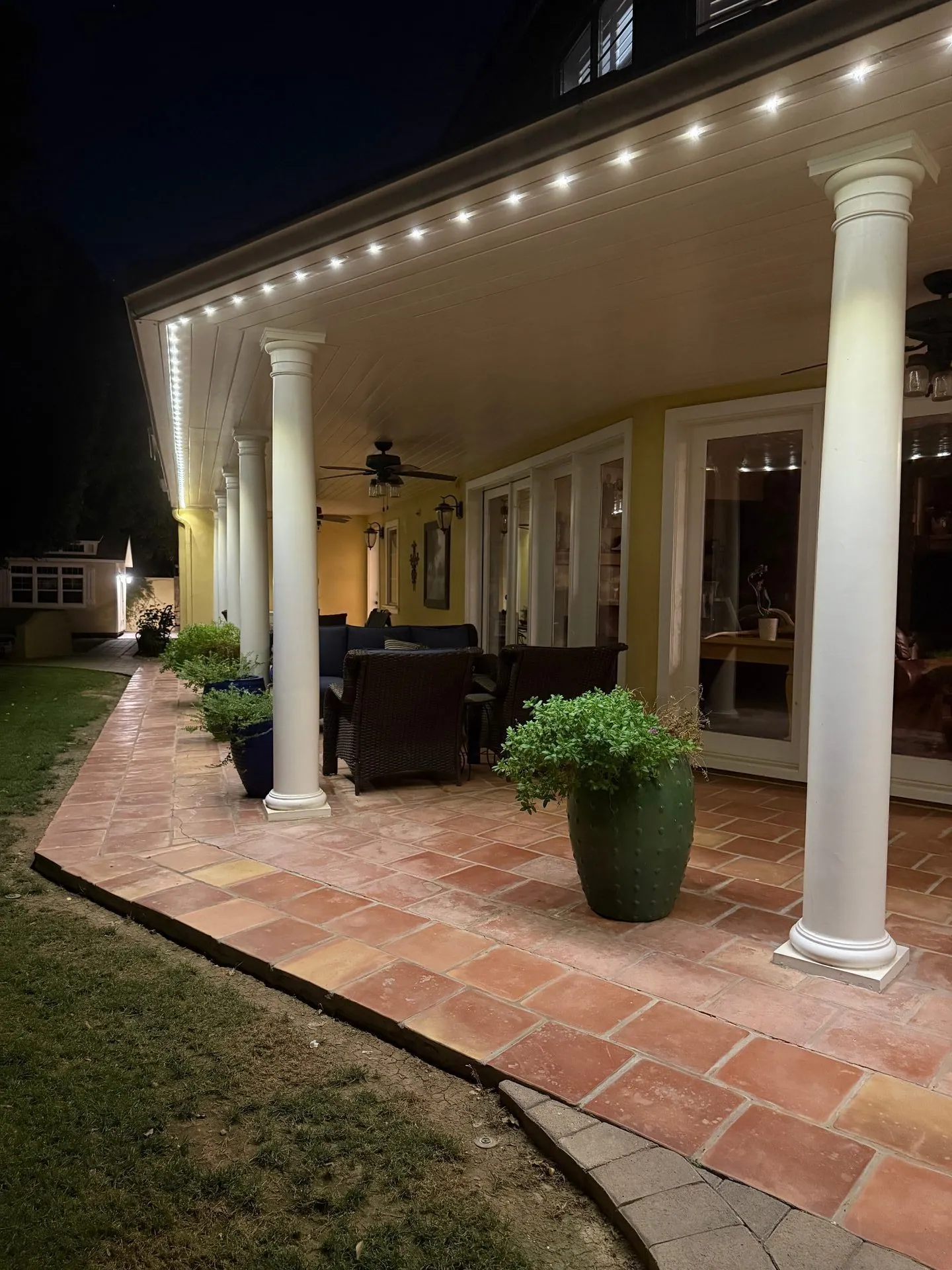 Permanent lighting on covered patio with columns