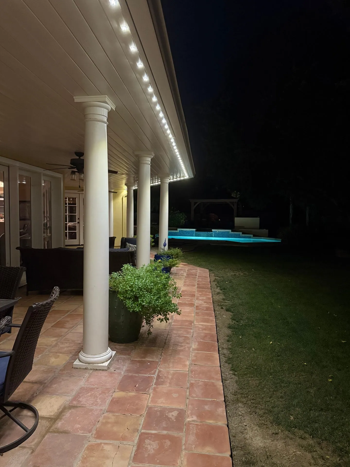 Patio lighting with pool view at night