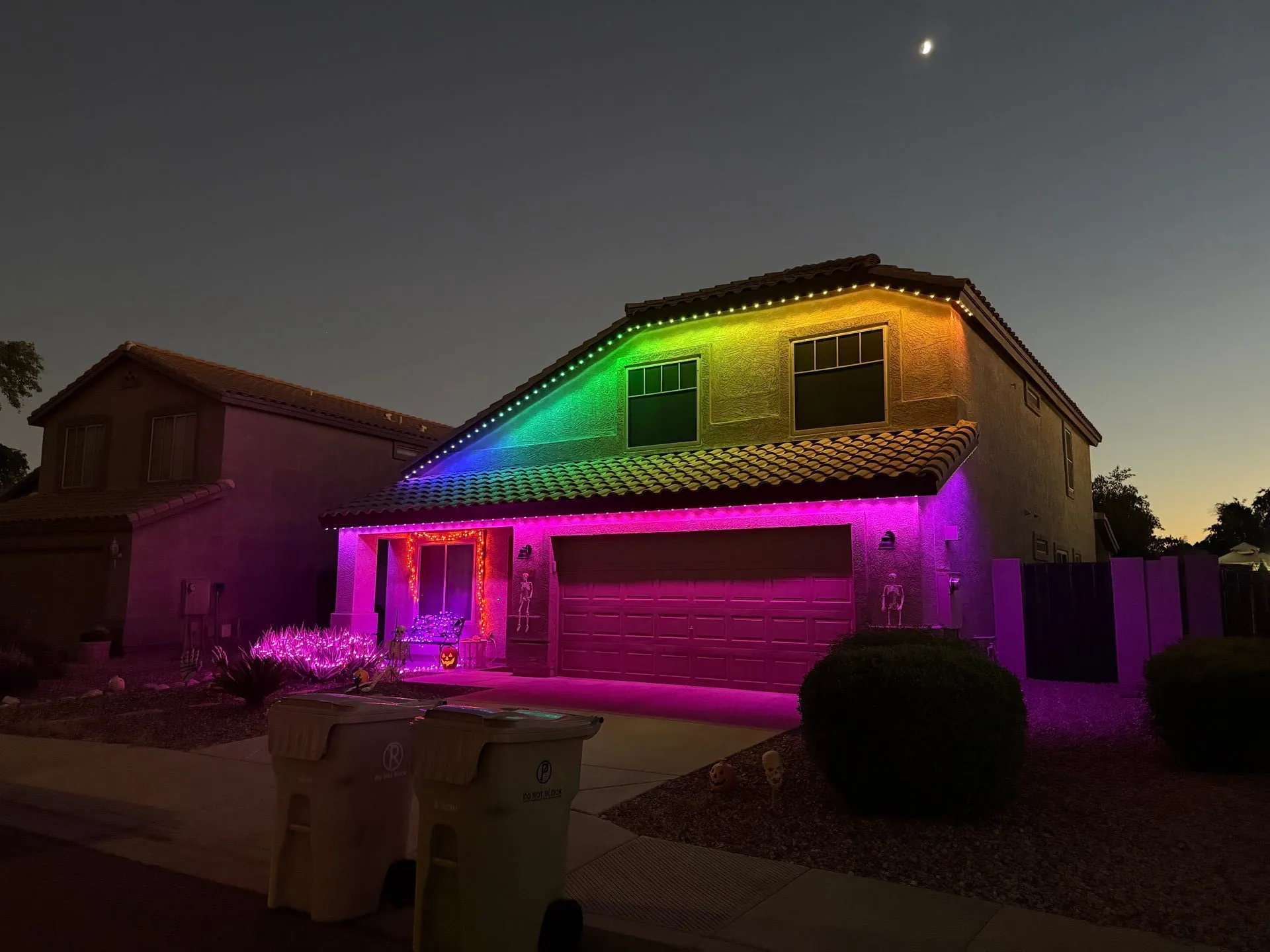 Rainbow color permanent lighting on two-story home
