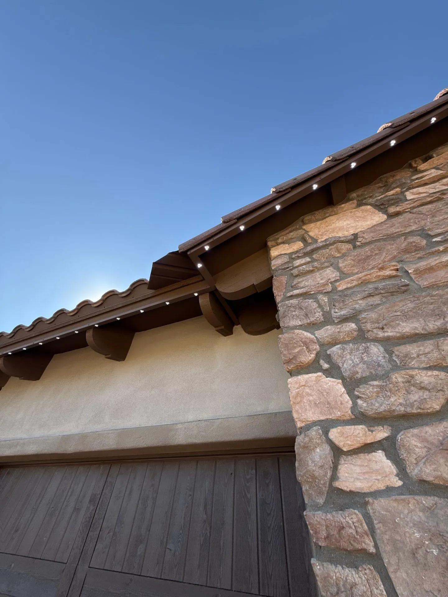 Permanent LED fixtures installed on tile roof eave
