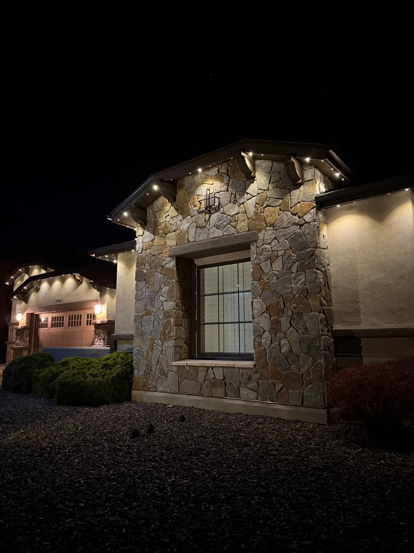 Close-up detail of permanent lighting on stone exterior