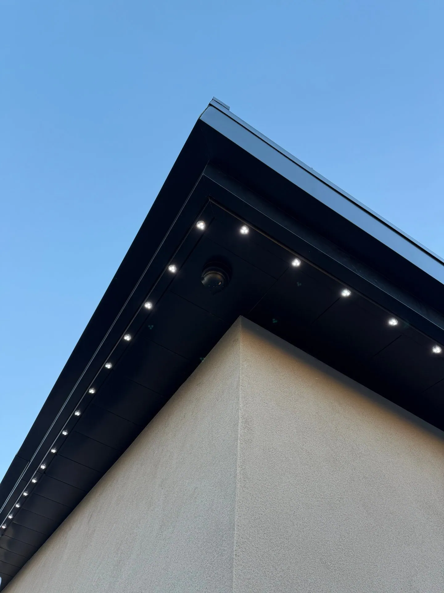 Close-up of permanent LED fixtures on modern roofline