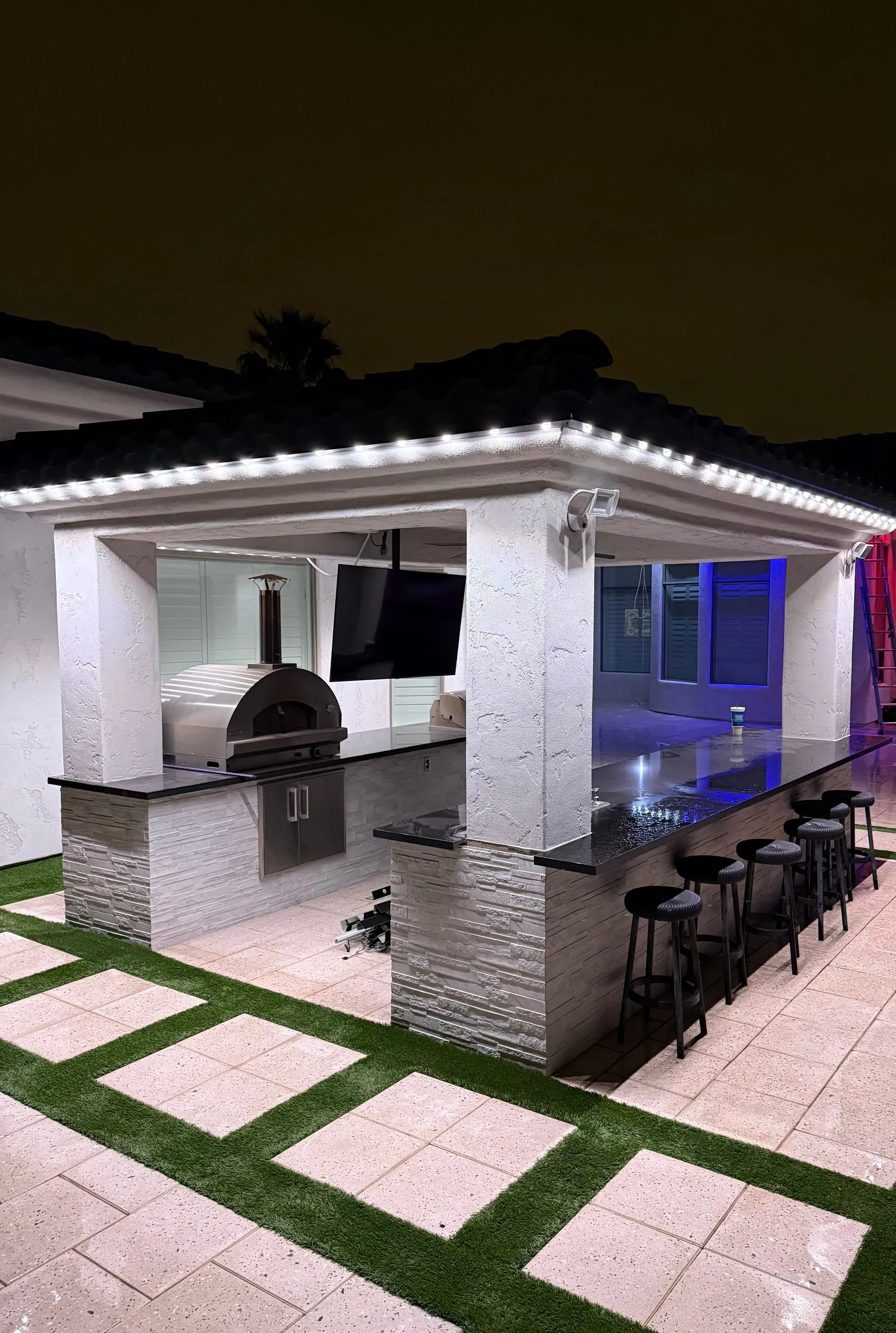 Permanent lighting on outdoor kitchen and bar area