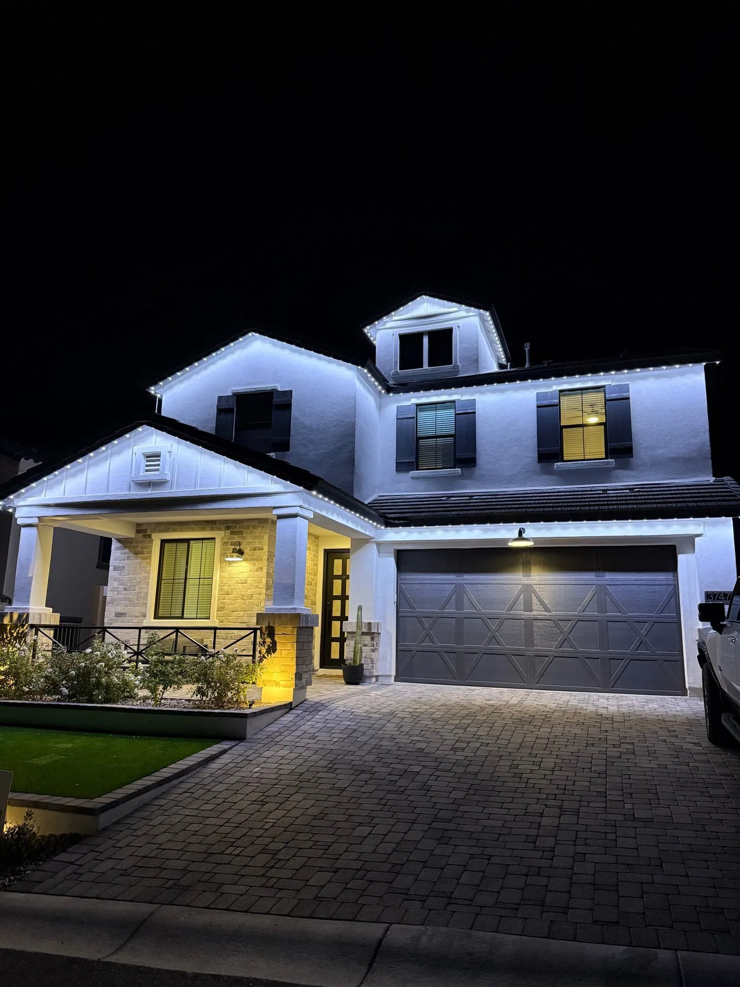 Two-story home with cool white permanent LED lighting