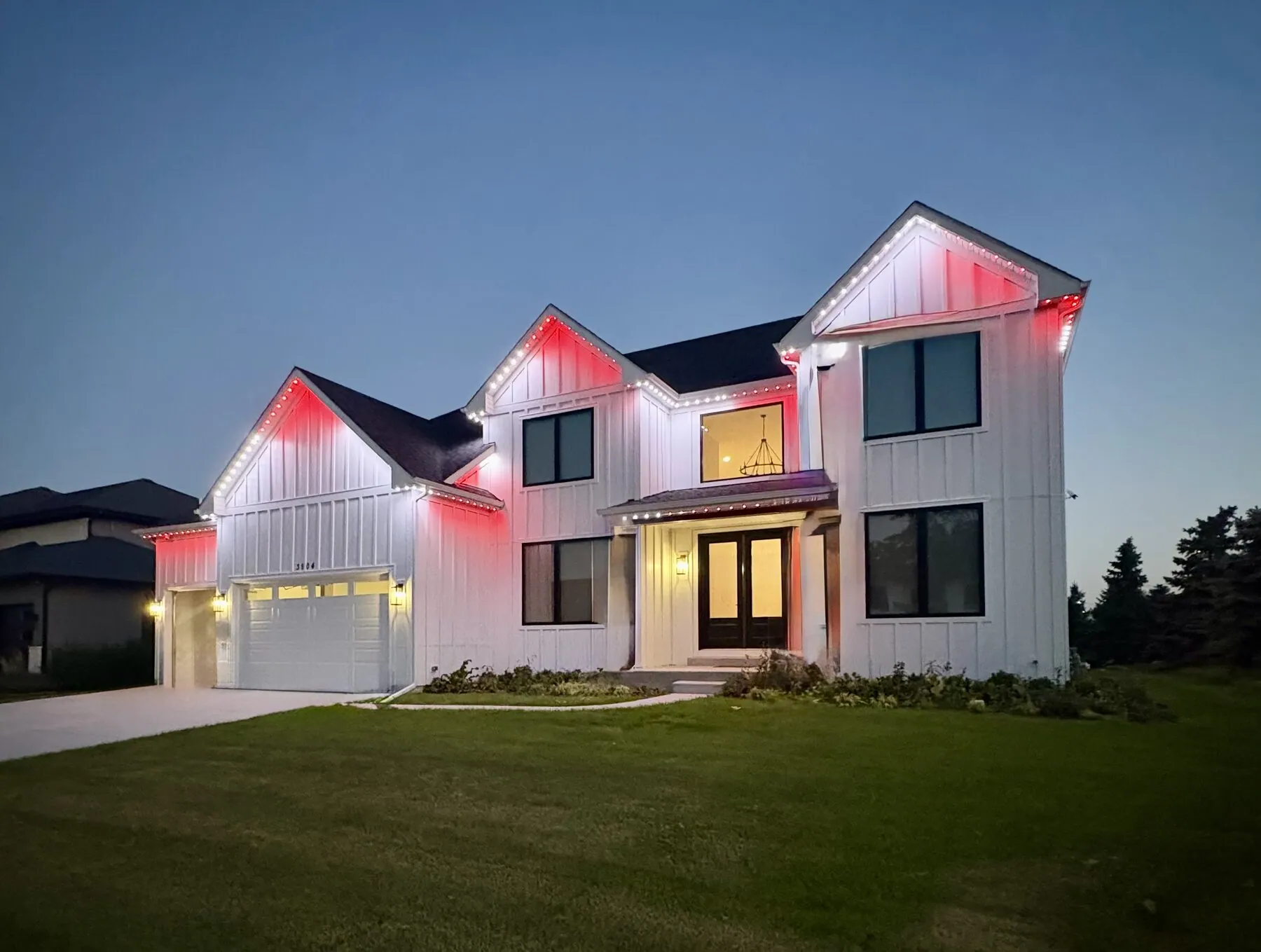 Red and blue accent lighting on a modern home